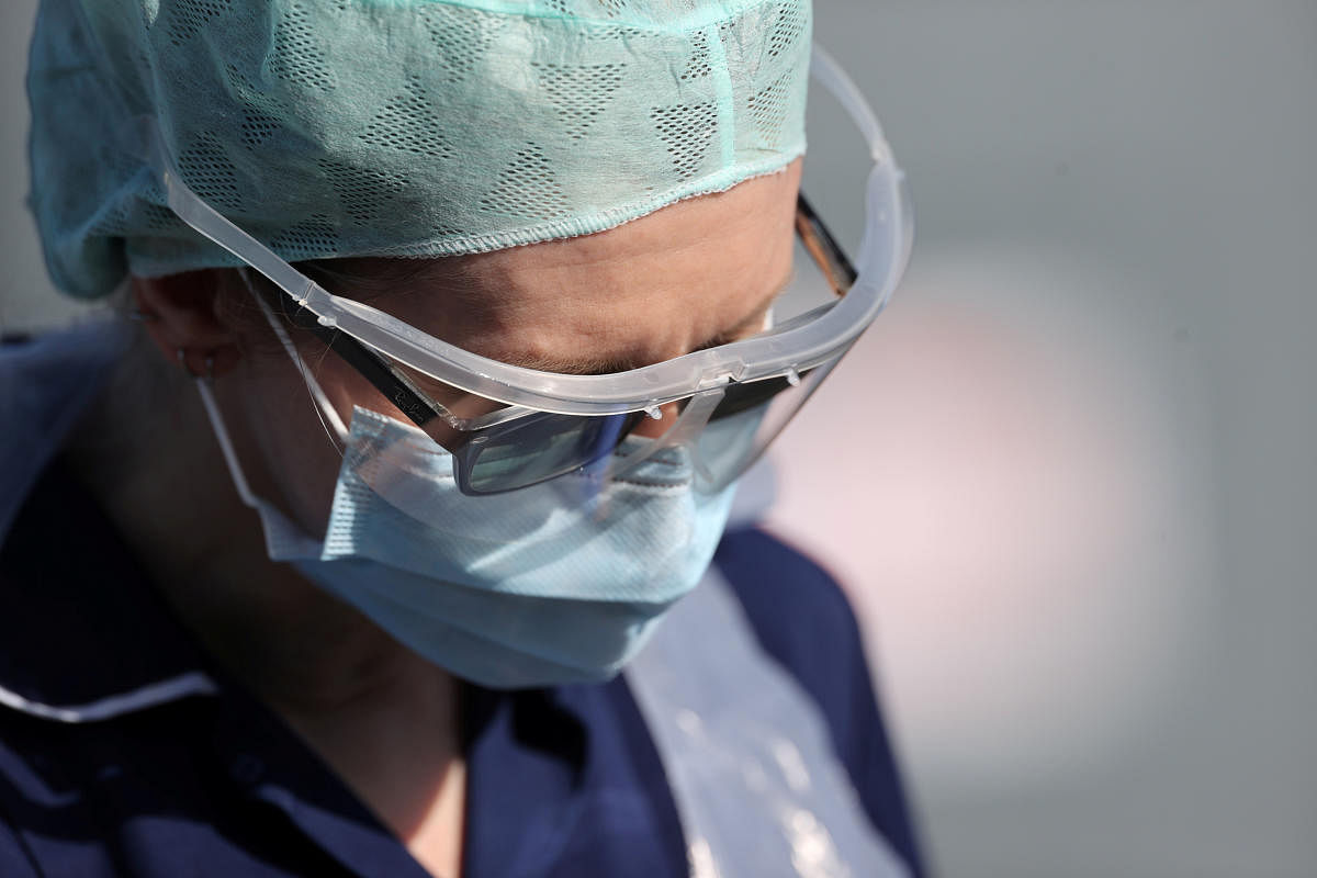 A member of medical staff is seen at an NHS coronavirus disease (COVID-19) testing facility (Reuters Photo)