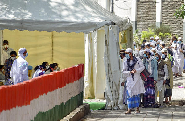 People who came for ‘Jamat’, a religious gathering at Nizamuddin Mosque, being taken to LNJP hospital for COVID-19 test, after several people showed symptoms of coronavirus, during a nationwide lockdown, in New Delhi, Tuesday, March 31, 2020. (Credit: PTI Photo/Vijay Verma)