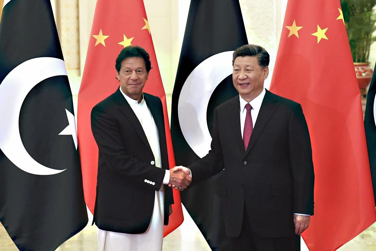 China's President Xi Jinping shakes hands with Pakistan's Prime Minister Imran Khan before a meeting at the Great Hall of the People in Beijing, China April 28, 2019. Photo/Reuters
