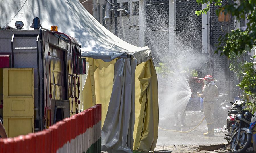 File photo of disinfectant being sprayed near Nizamuddin mosque. Credit: PTI Photo