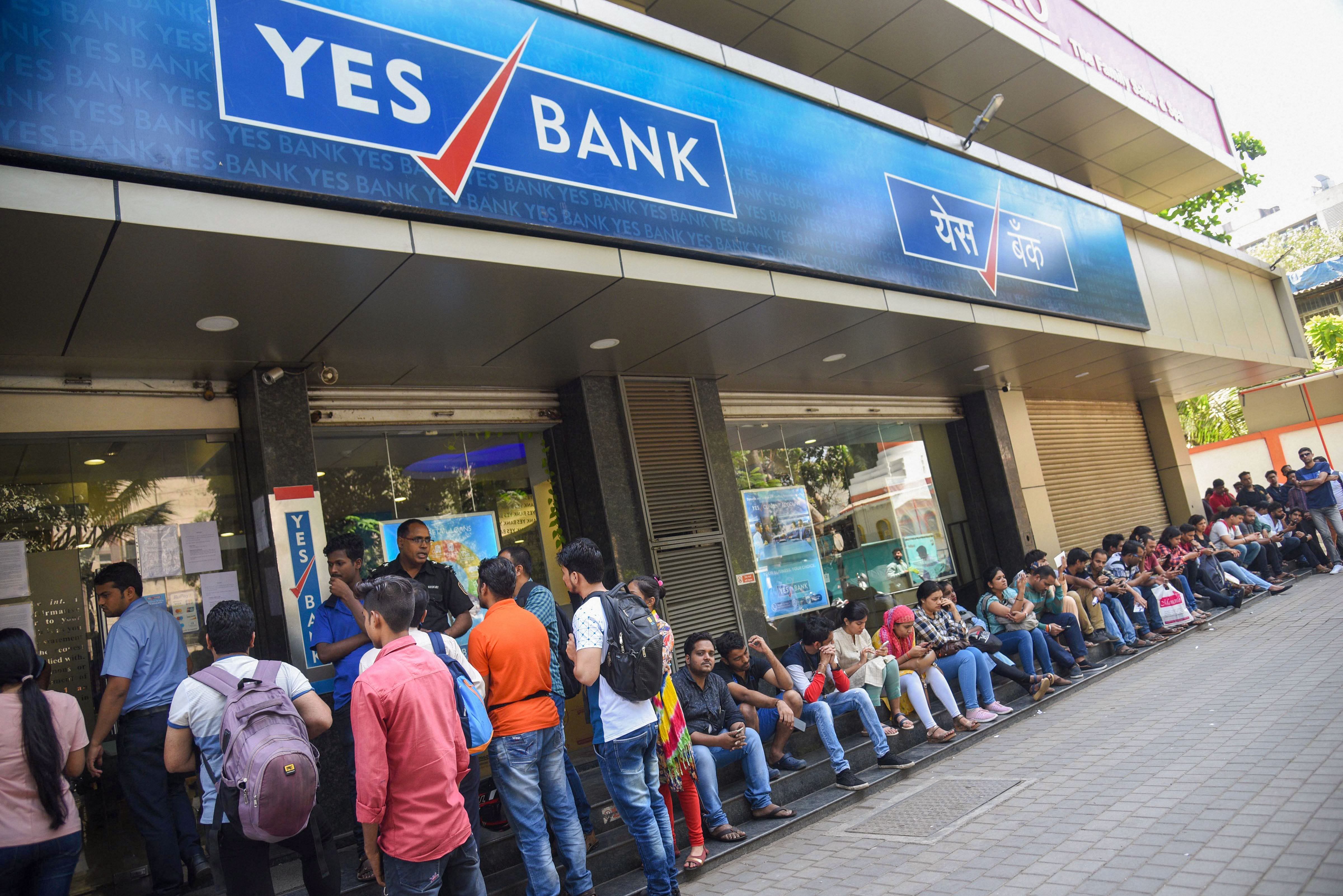 Account holders queue up outside Yes Bank to withdraw money, in Mumbai, Saturday, March 7, 2020. (Credit: PTI)