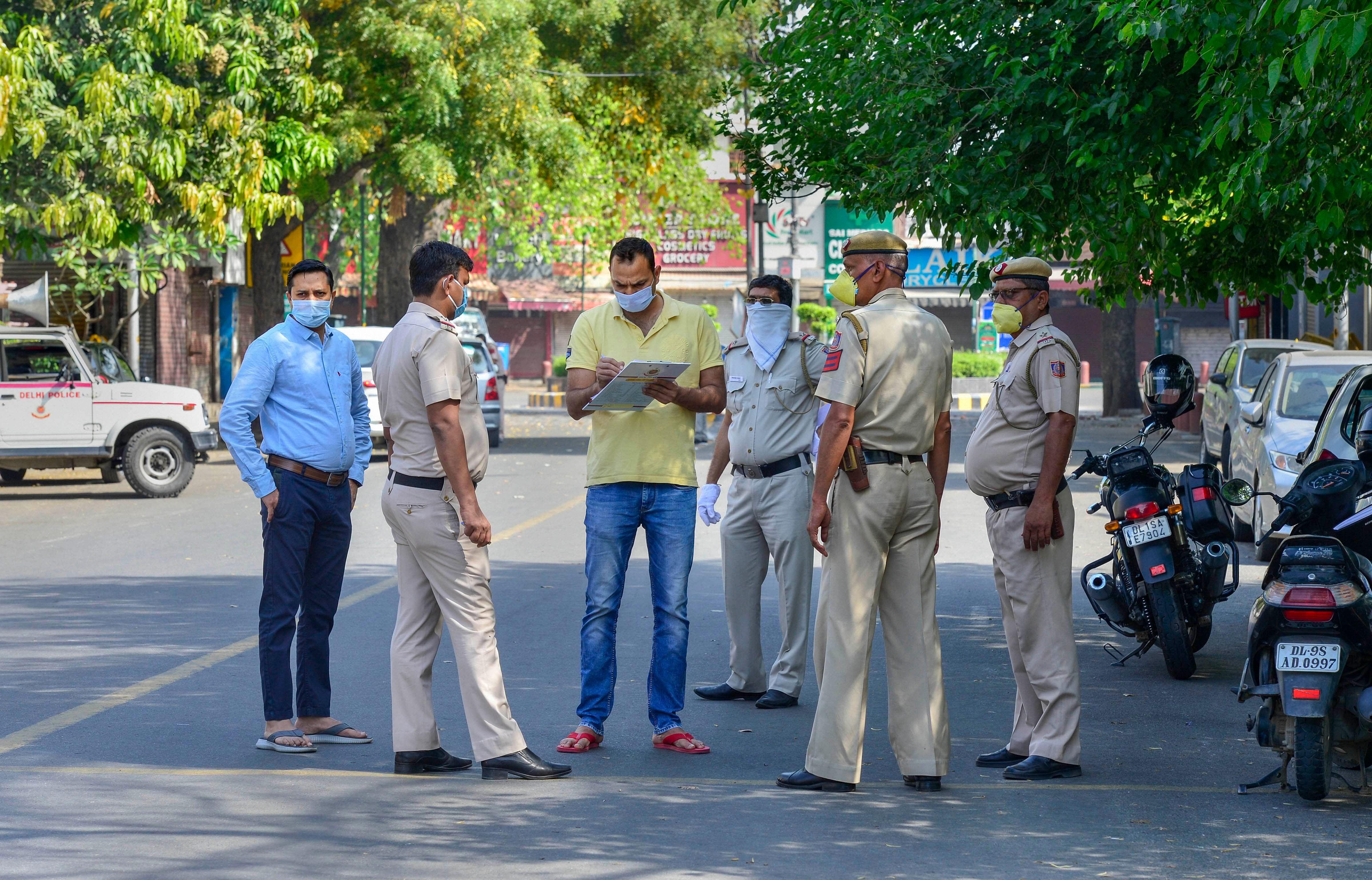Police personnel stand guard in an area near Bengali market,which has been identified as a containment zone, during the nationwide lockdown to curb the spread of coronavirus, in New Delhi. (PTI Photo)