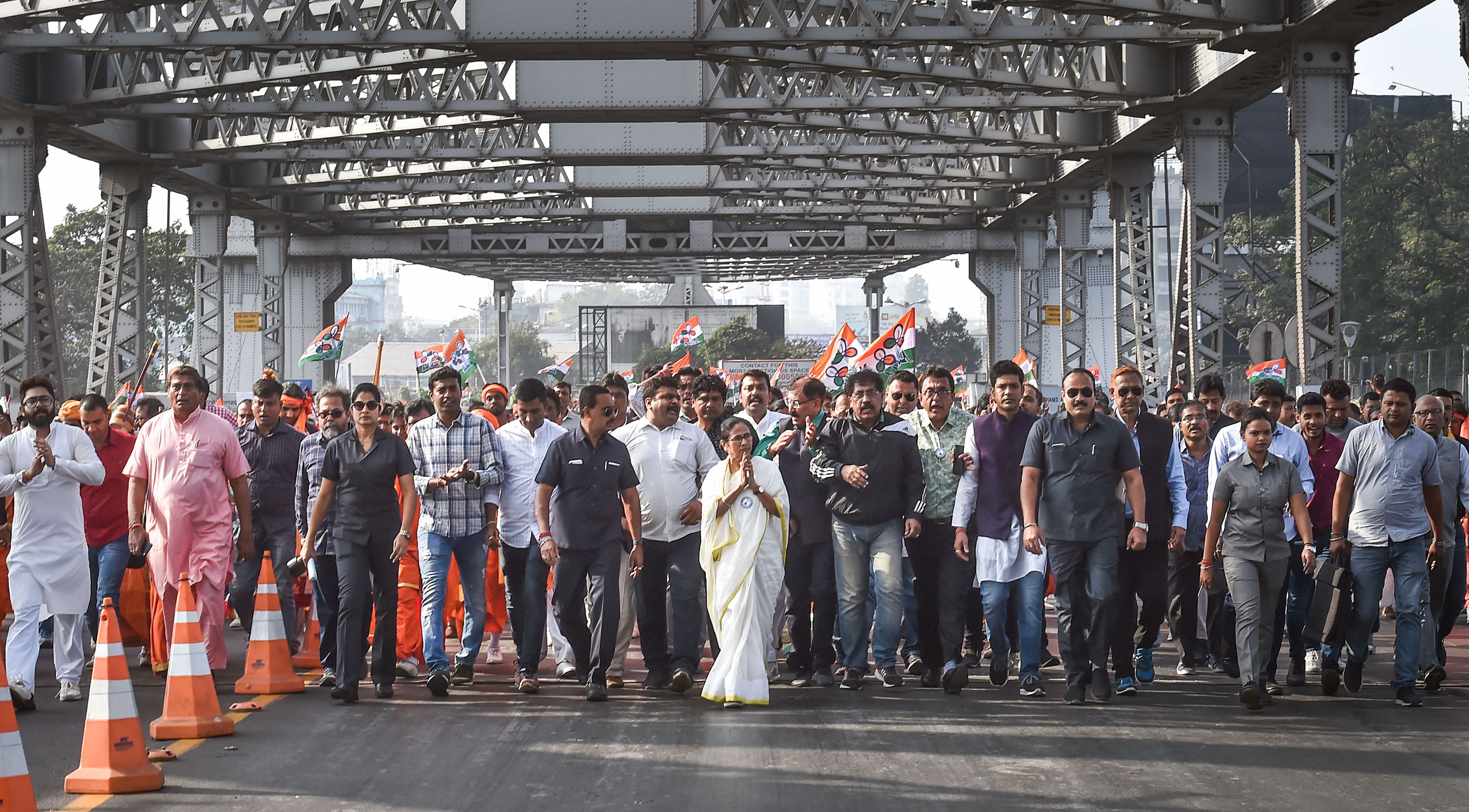 West Bengal Chief Minister and TMC chief Mamata Banerjee leads a protests rally of her party workers through Howrah Bridge, against the NRC and the Citizenship Amendment Act, in Kolkata, Wednesday, Dec. 18, 2019. (PTI Photo)