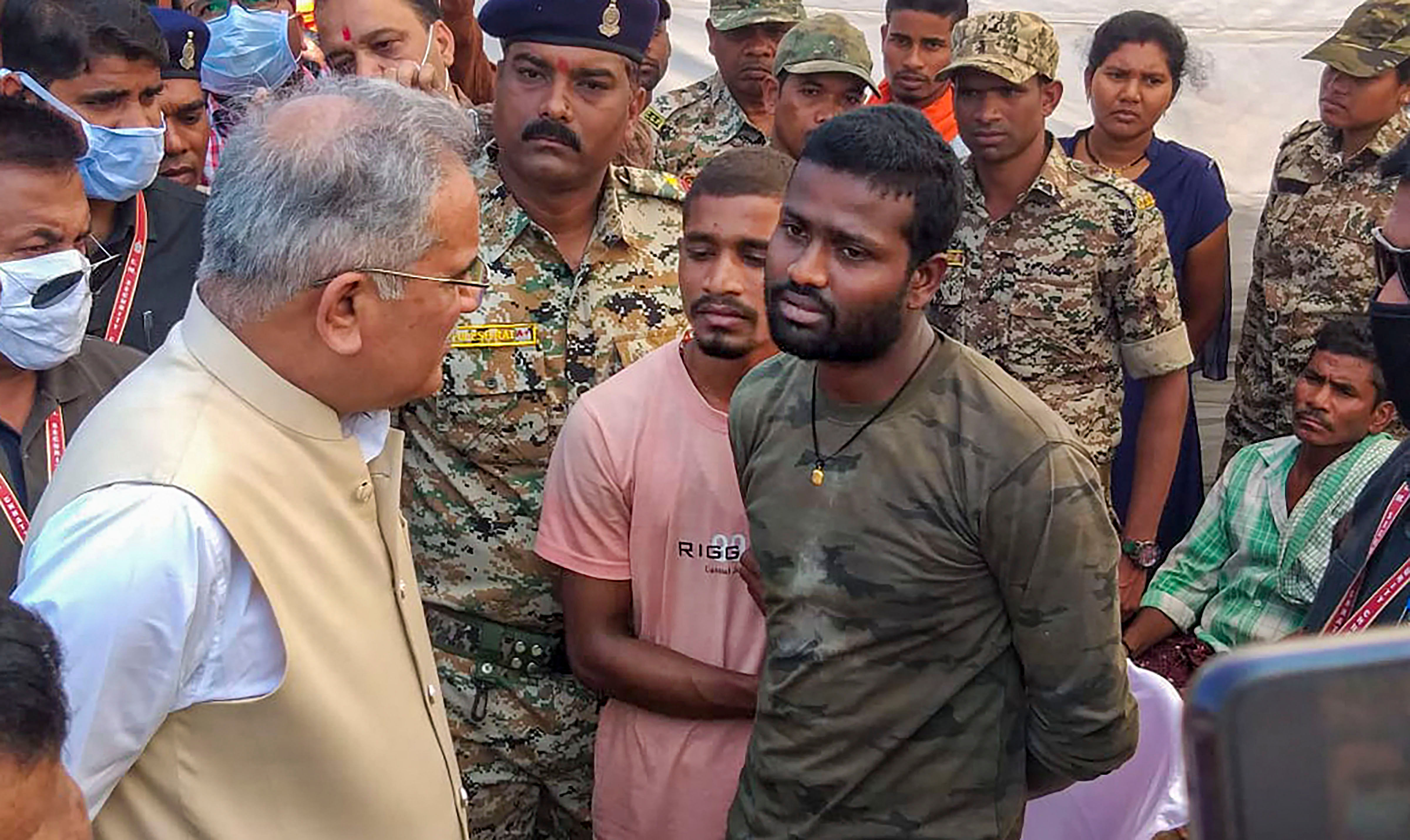 Chhattisgarh Chief Minister Bhupesh Baghel interacts with jawans after paying tribute to martyred troopers of STF and DRG, who lost their lives yesterday during the encounter between security forces and naxals. (Credit: PTI Photo)