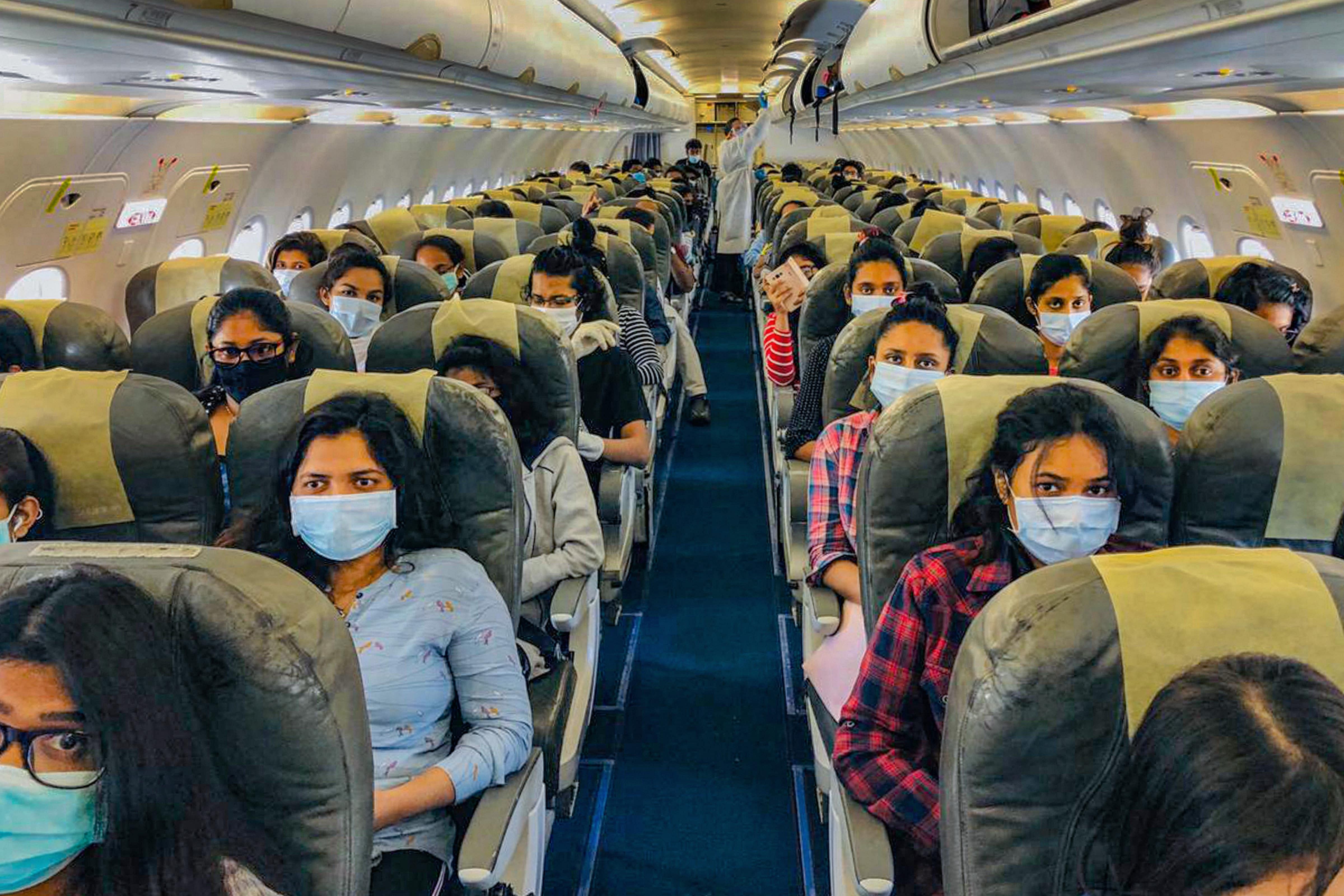  Sri Lankan students of Lovely Professional University (Jalandhar) board a special chartered plane for their home country, during the nationwide lockdown to curb the spread of coronavirus, in Amritsar. (Credit: PTI Photo)