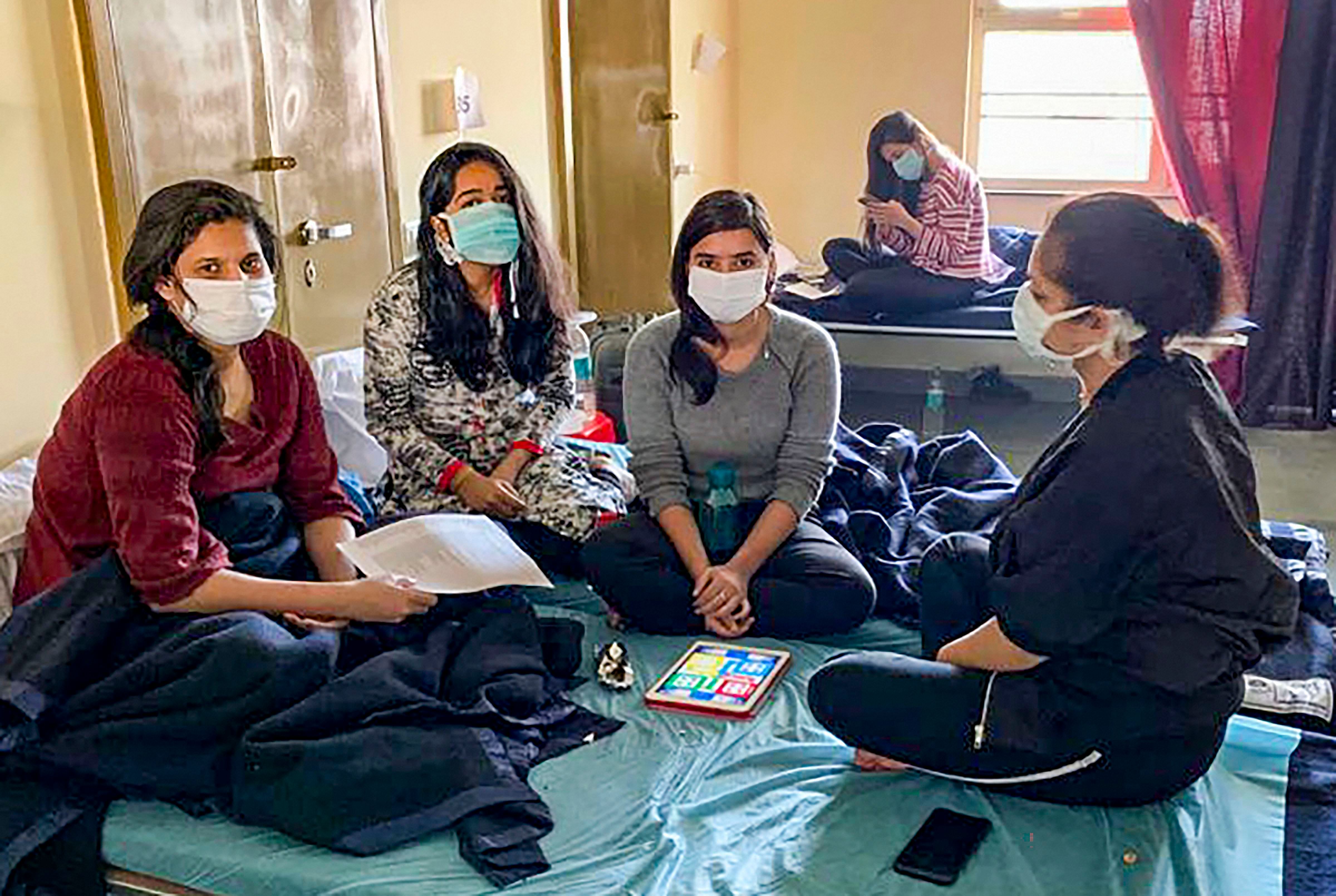 Indian nationals who were airlifted from coronavirus-hit Hubei province of China's Wuhan, at the ITBP's quarantine facility at Chhawla in New Delhi, Sunday, Feb. 16, 2020.  (Credit: PTI Photo)