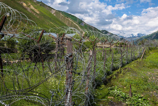 Razor wire fences, deterring militant infiltration from Pakistan, run the length of the Gurez and Tulail valleys, seen from the Tulail Valley in India, in Kashmir. (DH File photo)