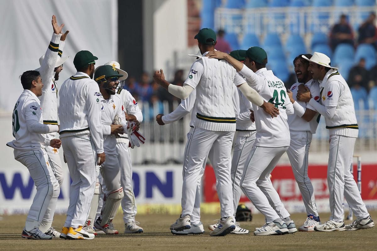 Pakistan players celebrate after the dismissal of Bangladesh Liton Das during the fourth day of their 1st test cricket match against Bangladesh at Rawalpindi cricket stadium in Rawalpindi. (AP Photo)