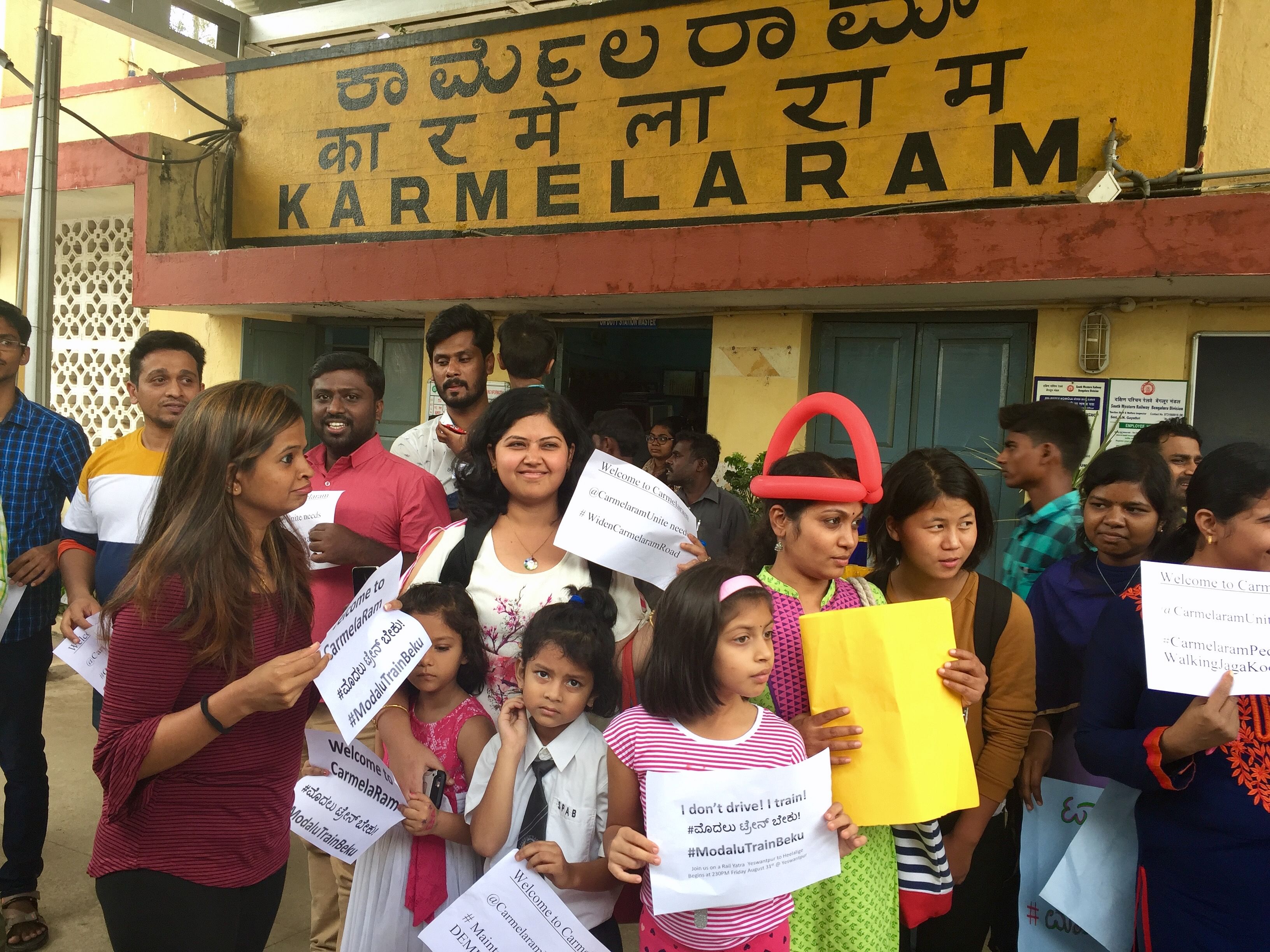 The participants of the rail yatra taken out to raise awareness about the city’s rail network board the train at Karmelaram on Friday. DH Photo/Grace Hauck