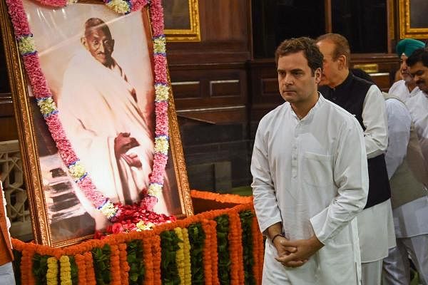 Rahul Gandhi, former Indian Congress Party president, walks past a portrait of Indian independence icon Mahatma Gandhi at Parliament House in New Delhi on October 2, 2019 to mark Gandhi's 150th birth anniversary. (Photo/PTI)
