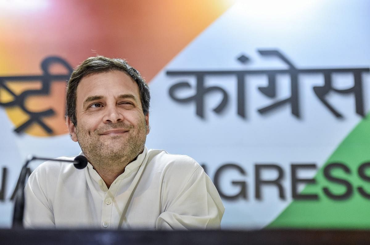 Congress President Rahul Gandhi smiles as he addresses the media at party office, in New Delhi, on Saturday. PTI photo