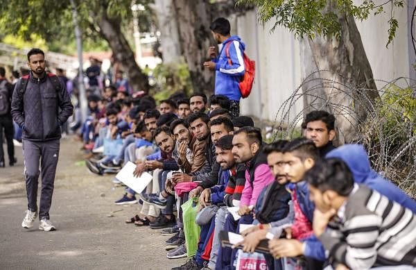 Applicants wait to give physical test for the post of Special Police Officers (SPO) in Government Railway Police (GRP), in Jammu, Wednesday, Nov. 27, 2019. (PTI Photo)