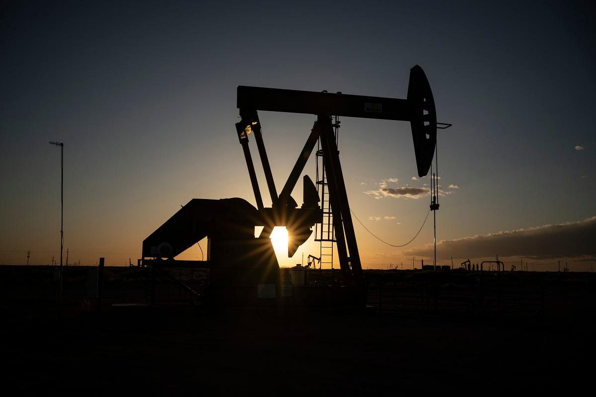 Crude oil pump jacks operating (AFP Photo)