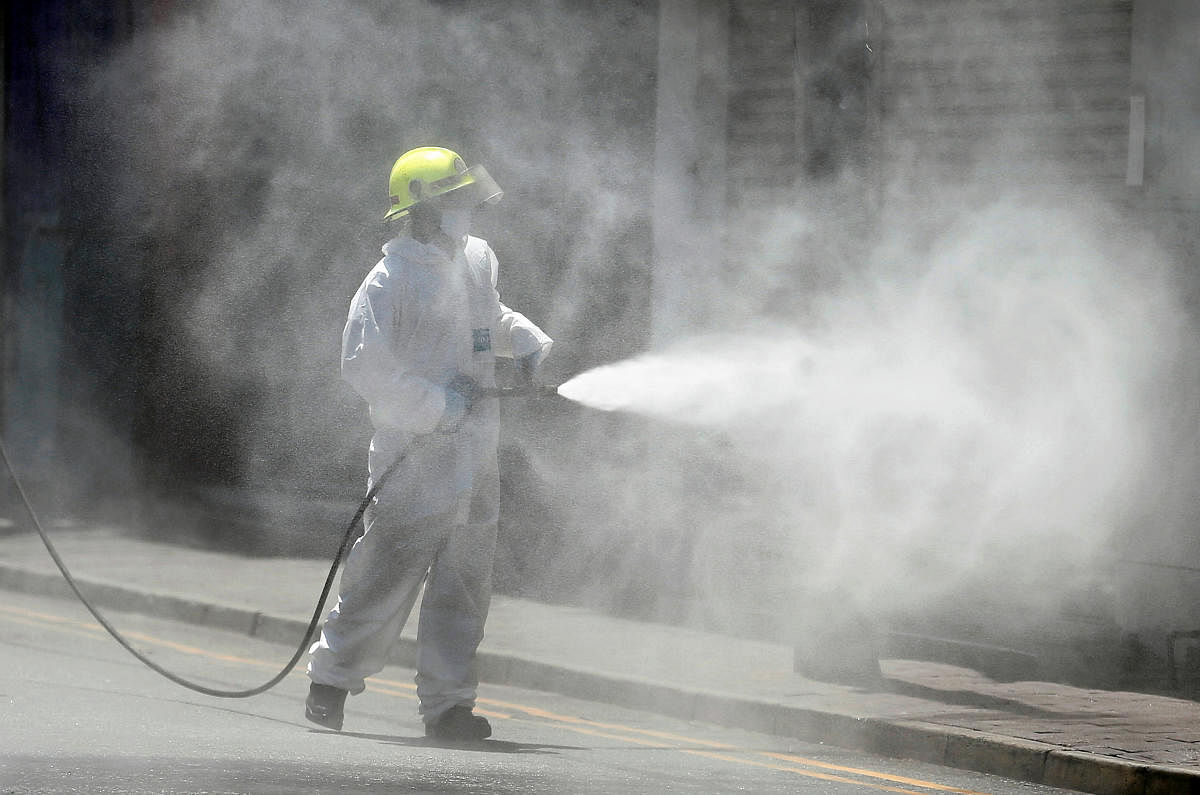 Firefighter sprays disinfectants along a street in Colombo as Sri Lankan government expects to re-open the country (Reuters Photo)