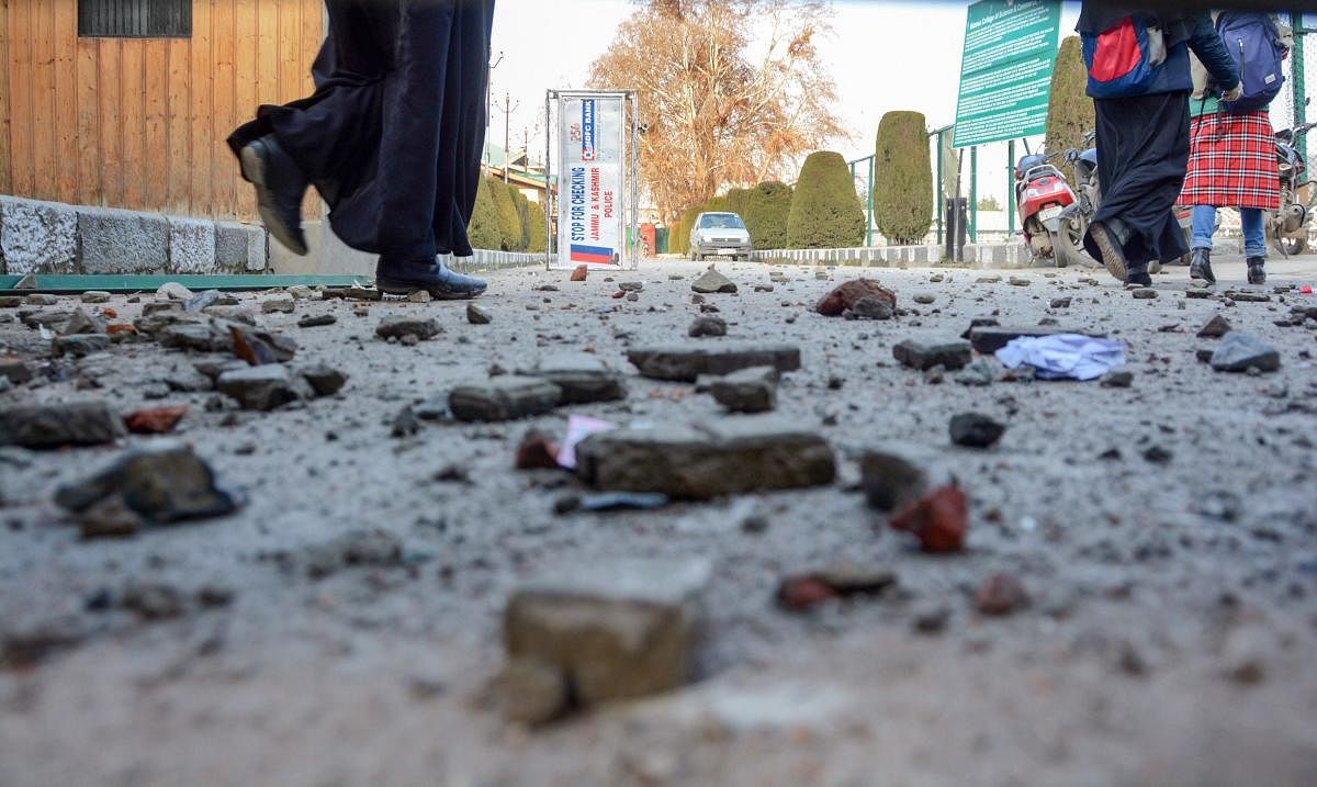 Stones pelted during clashes between students and police during a protest against police atrocity on students of Jamia Millia Islamia University in New Delhi and against the Citizenship Amendment Act (CAA), near Islamia College of Science and Commerce in Srinagar. (PTI file photo)