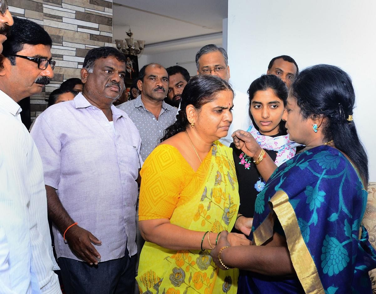 Governor of Telangana Tamilisai Soundararajan meets famiy members of Priyanka Reddy, who was working as an assistant veterinarian at a state-run hospital and whose charred remains was found under a culvert, in Hyderabad, Saturday, Nov. 30, 2019. (PTI Photo