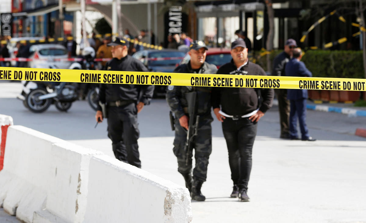 Police officers stand guard at the site of a suicide attack near the U.S. embassy in Tunis (Reuters Photo)