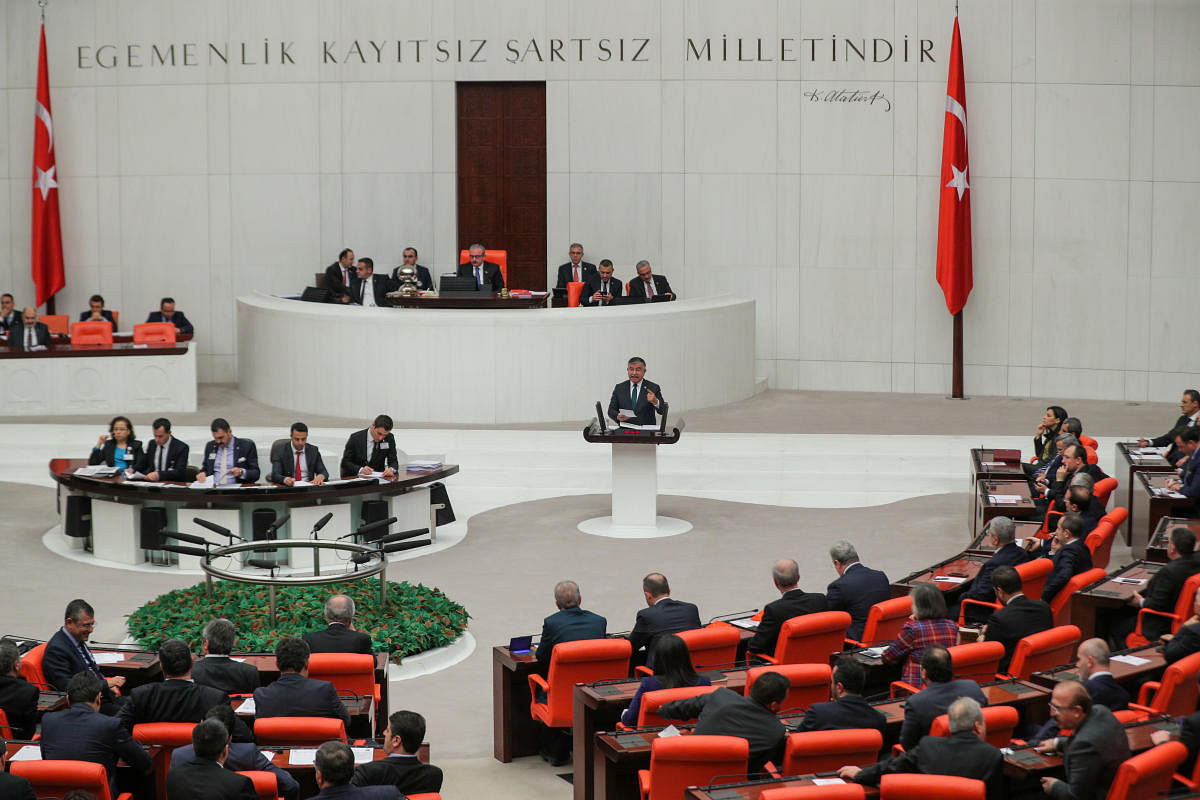 Turkish lawmakers vote a bill that allows troop deployment to Libya, at the Parliament in Ankara. Reuters