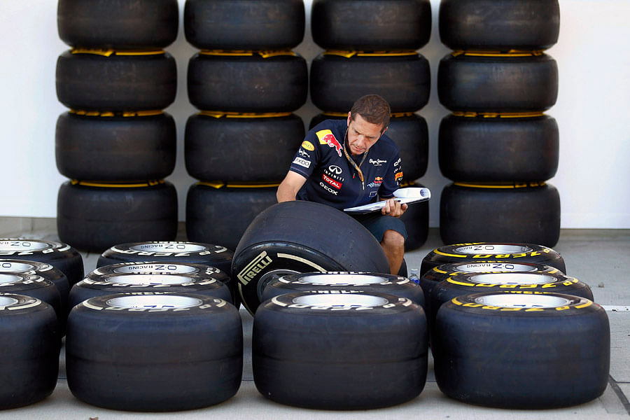 A mechanic checking a batch of tyres. Picture credit: Pirelli