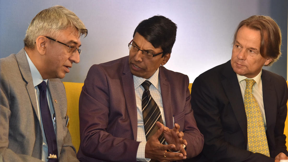 (From left) Rajesh Nath, Managing Director of VDMA, Shivayogi C Kalasad, Managing Director of Karnataka State Road Transport Corporation and Peter Schmid, Head of Administration, Consulate General of the Federal Republic of Germany, Bengaluru at the inauguration of Electric Mobility – Disrupting Technology in the Transportation Industry in Bengaluru on Thursday, November 21, 2019. (DH Photo/Janardhan B K)