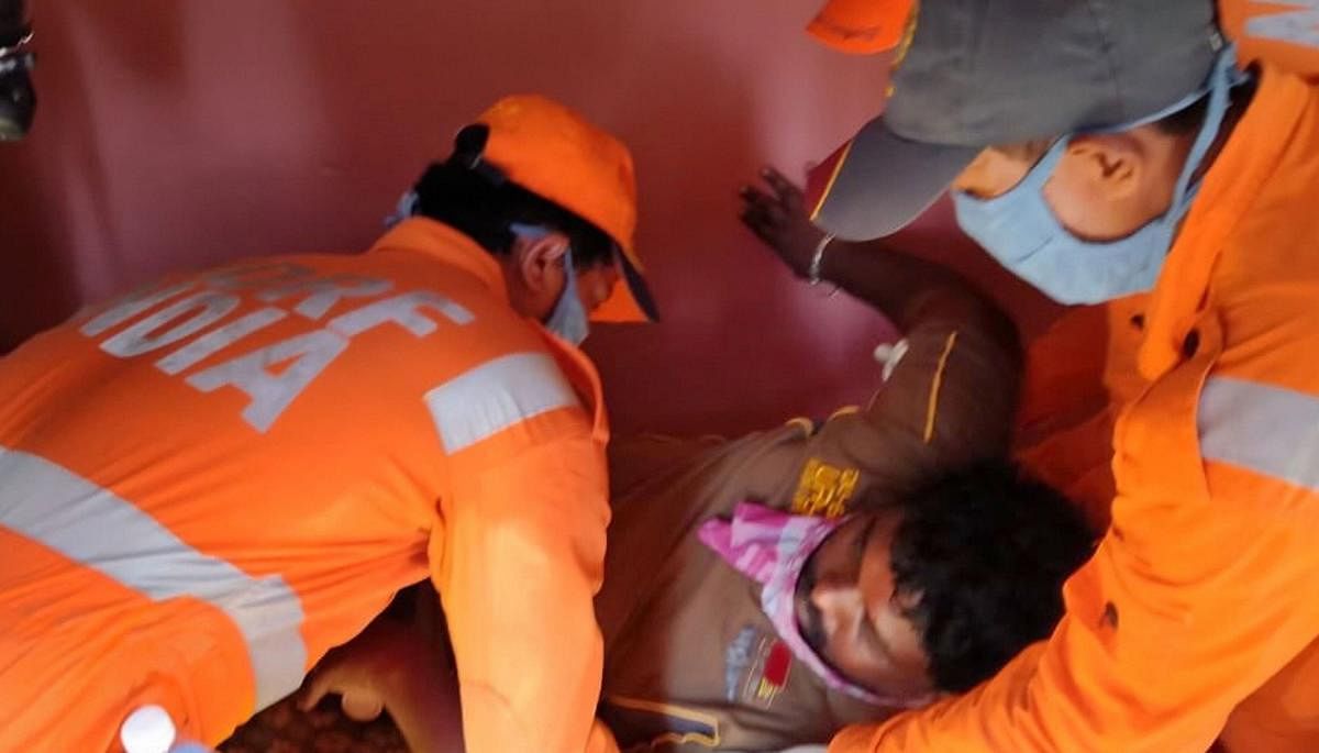  NDRF personnel evacuate an unconscious man after a major chemical gas leakage at LG Polymers industry (PTI Photo)