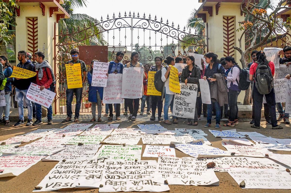 : Left wing students shout slogans outside the central office of Visva-Bharati during a protest against university authorities. (PTI Photo)