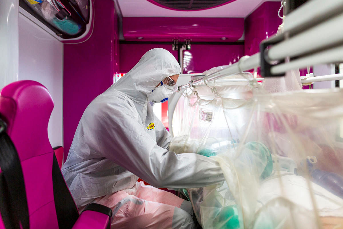 Medical worker in a protective suit monitors a coronavirus patient (Reuters Photo)