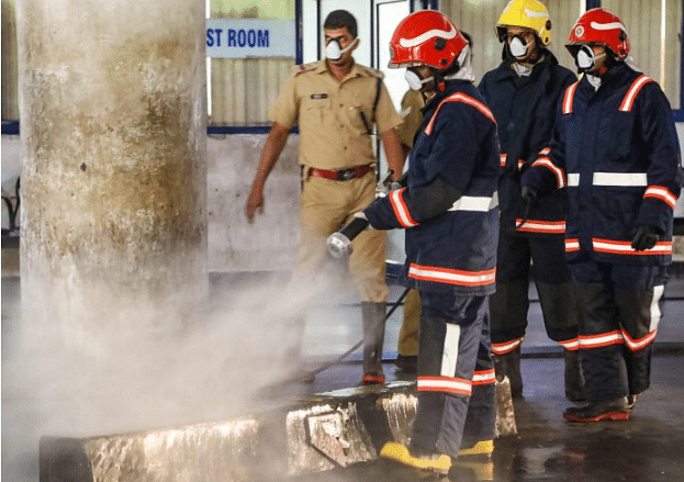 Representative image --Workers spray disinfectant in the premises of KSRTC bus stand to contain the spread of coronavirus, in Kozhikode (PTI File Photo)