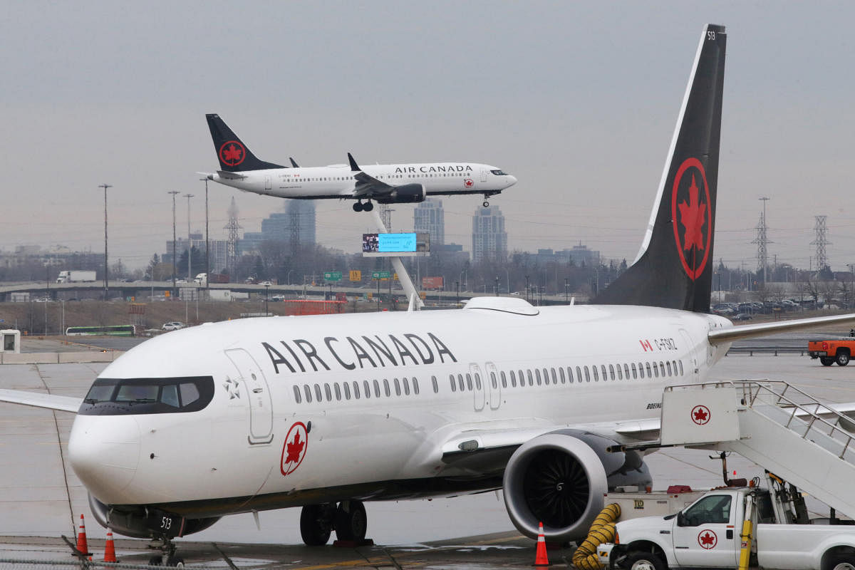 An Air Canada Boeing 737 MAX 8 from San Francisco approaches for landing at Toronto Pearson International Airport over a parked Air Canada Boeing 737 MAX 8 aircraft in Toronto, Ontario, Canada, March 13, 2019. Credit: Reuters Photo