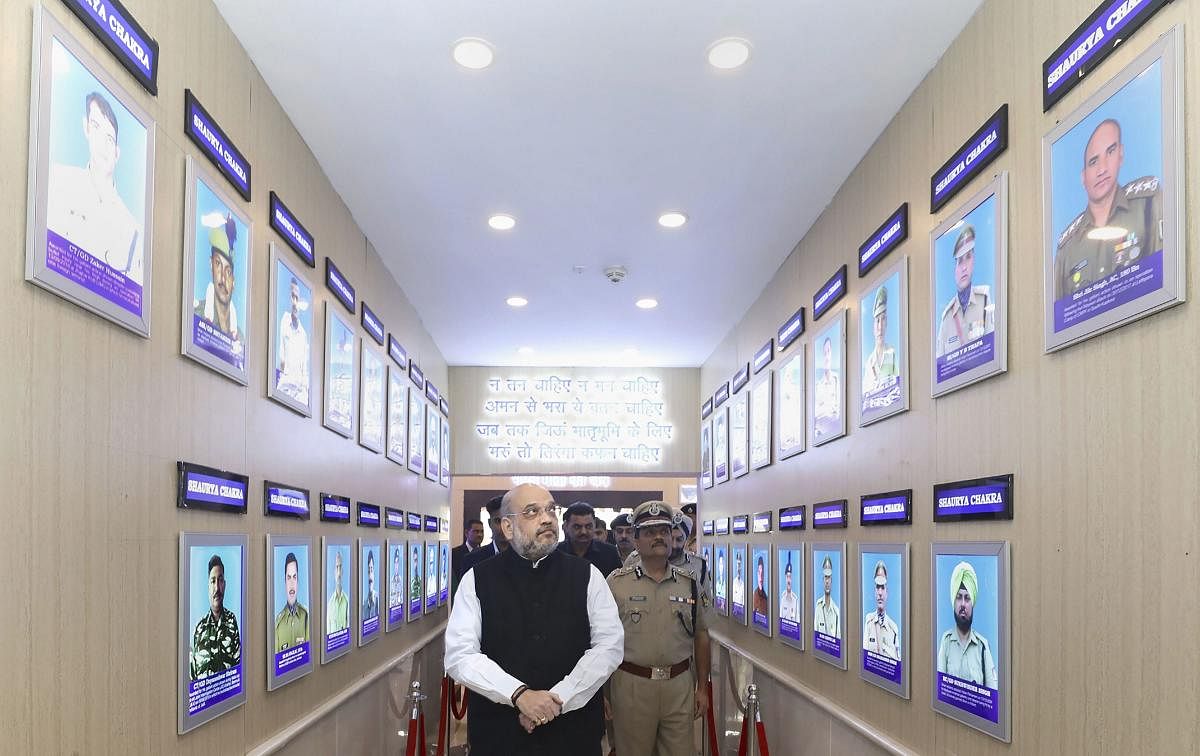 Union Home Minister Amit Shah in the gallery of gallantary award winners during his visit at the CRPF Head Quarters, in New Delhi. PTI