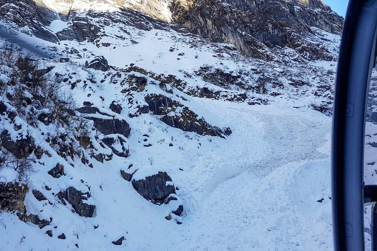  In this file photo taken on January 20, 2020, a general view shows from a helicopter the avalanche site in Annapurna mountain region, some 200 kms west of Kathmandu. AFP