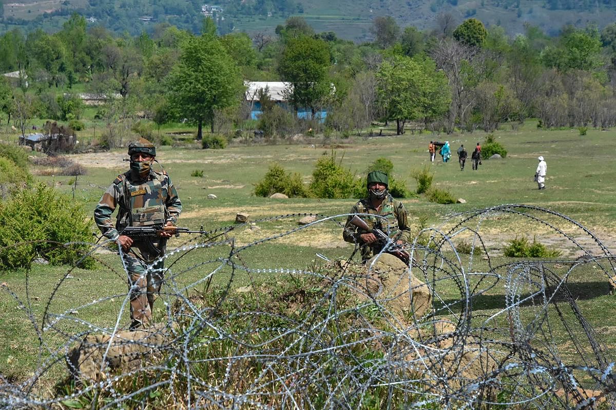 Indian army soldiers patrol near the Line of Control (LoC) in Mendhar sector of Poonch district, Sunday, April 12, 2020.  Credit: PTI Photo