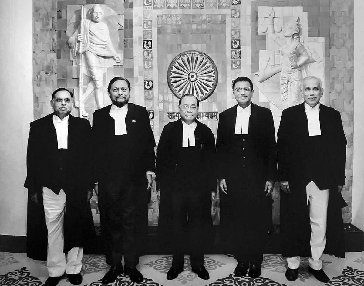 A group photo of the five-judge bench comprised of Chief Justice of India Ranjan Gogoi (C) flanked by (L-R) Justice Ashok Bhushan, Justice Sharad Arvind Bobde, Justice Dhananjaya Y Chandrachud, Justice S Abdul Nazeer after delivering the verdict on Ayodhya land case. PTI