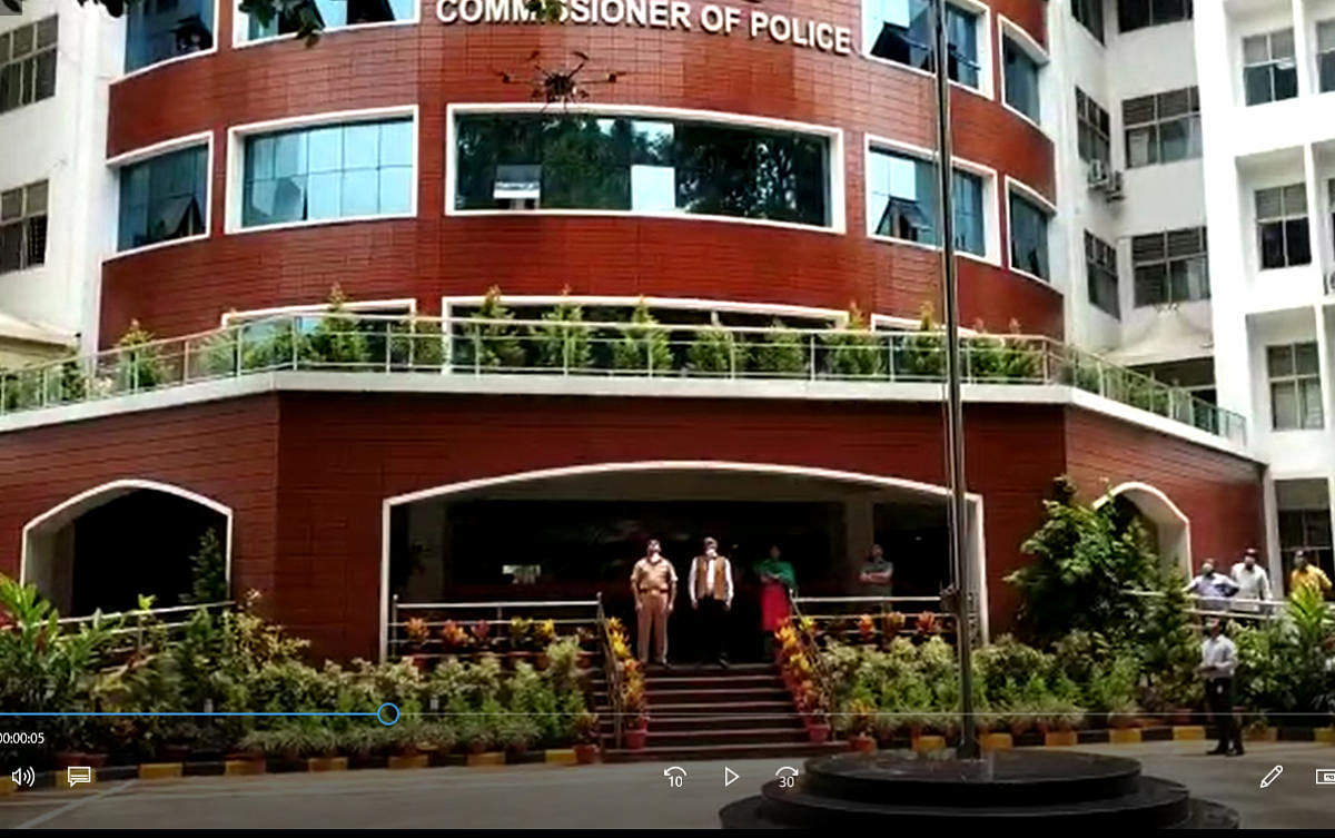 A screenshot of a drone flying above the police commissioner's office. 