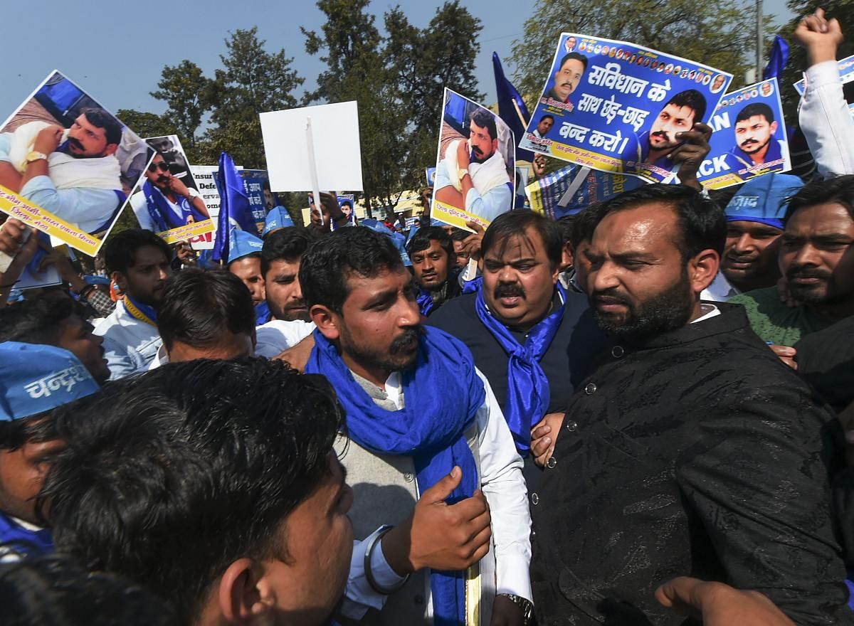 Bhim Army chief Chandra Shekhar Aazad with his supporters during a protest march against the Supreme Court's ruling that state governments are not bound to provide reservation in promotions in public services, in New Delhi, Sunday, Feb. 16, 2020. (PTI Photo)