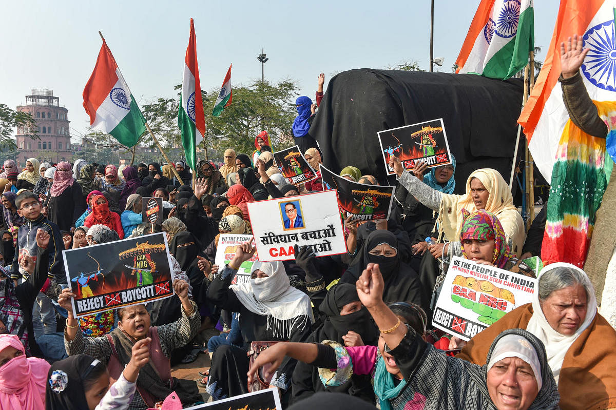 Muslim women stage a protest against CAA and NRC near the Ghantaghar in the old city area of Lucknow, Saturday, Jan. 25, 2020.  (PTI Photo)