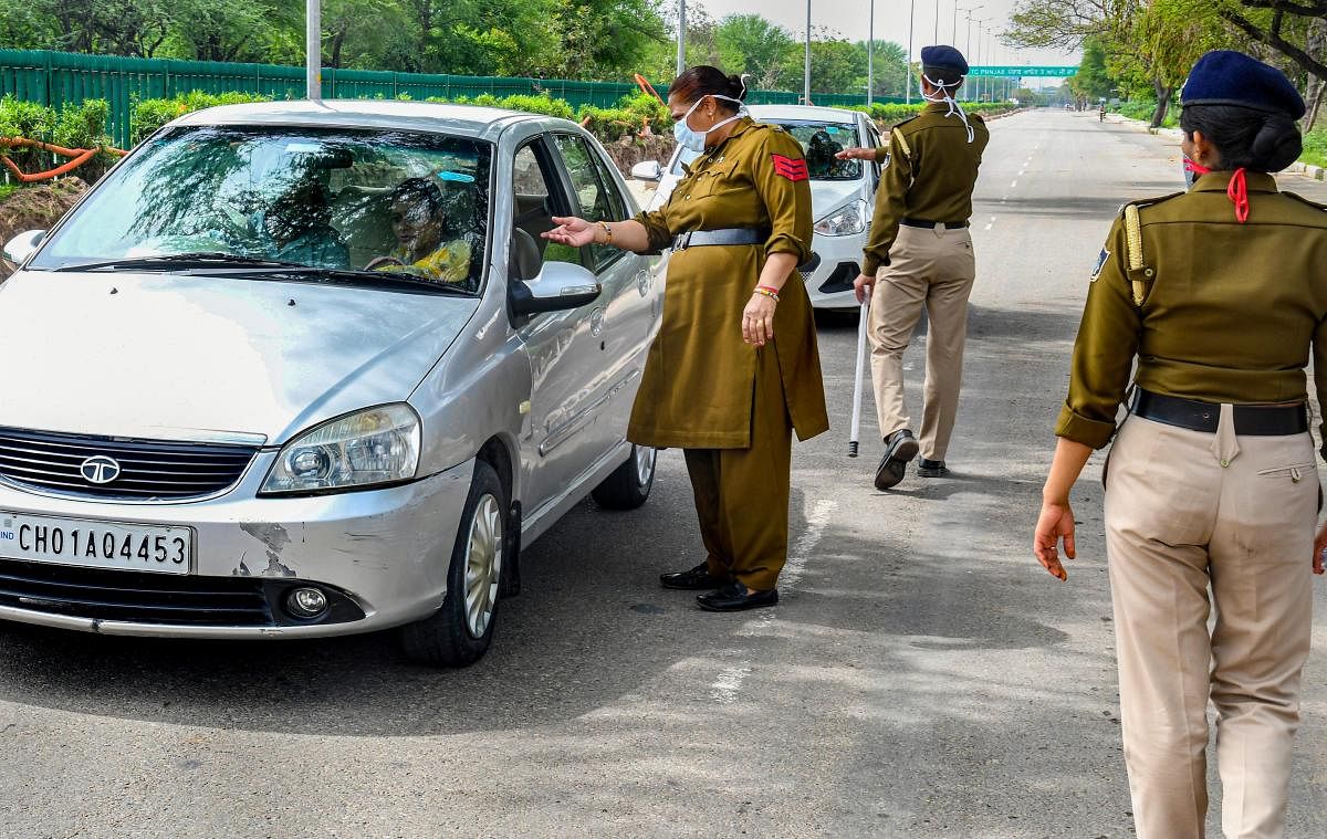 Police stop vehicles in Chandigarh during complete lockdown (PTI Photo)