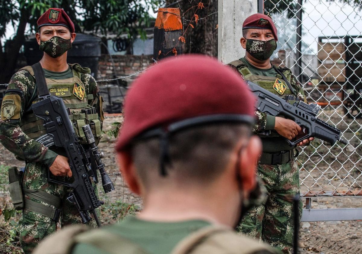Soldiers wear face masks as a preventive measure against the spread of the new coronavirus, COVID-19, as they stand guard in Cucuta, Colombia (AFP Photo)