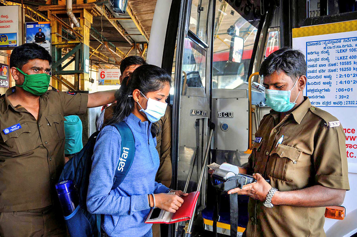 KSRTC bus conductor and passengers wear protective masks in view of coronavirus pandemic in Chikmagalur, Sunday, March 15, 2020. (PTI Photo)