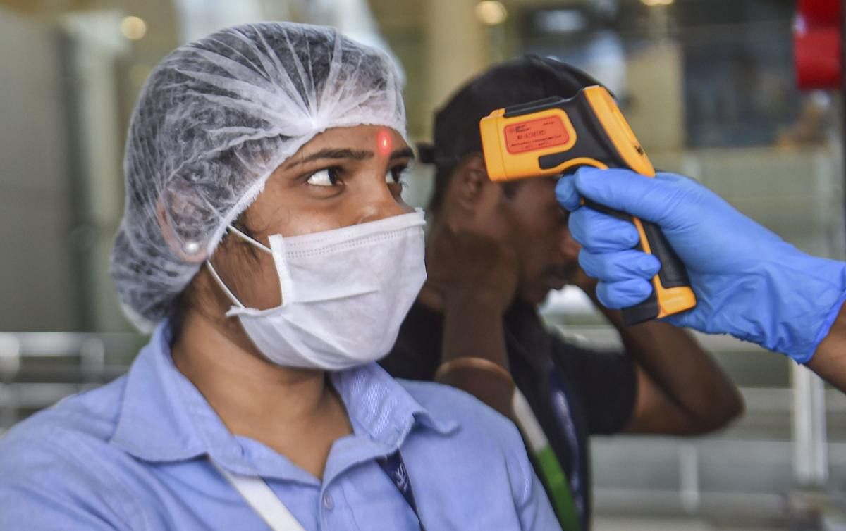 Thermal screening being conducted in the wake of deadly coronavirus, at Chennai airport, Tuesday, March 17, 2020. (PTI Photo)