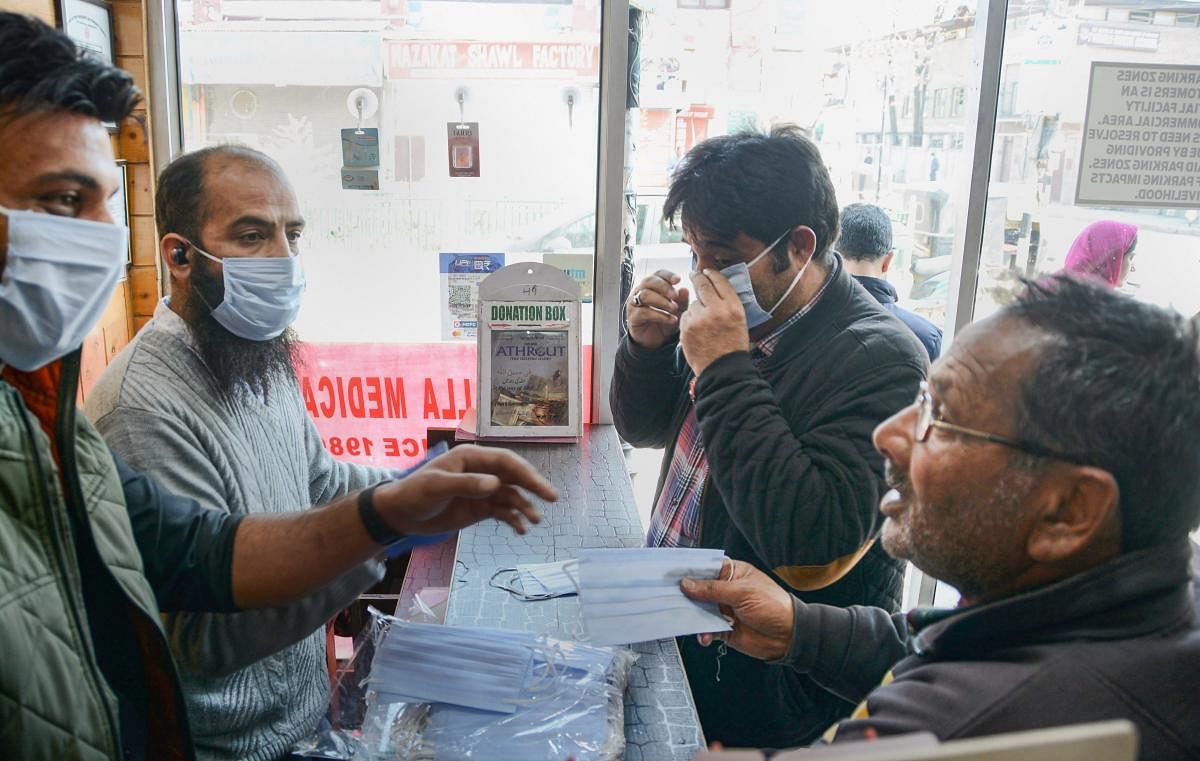  People buy protective masks in wake of coronavirus (COVID-19) pandemic, in Srinagar (PTI Photo)