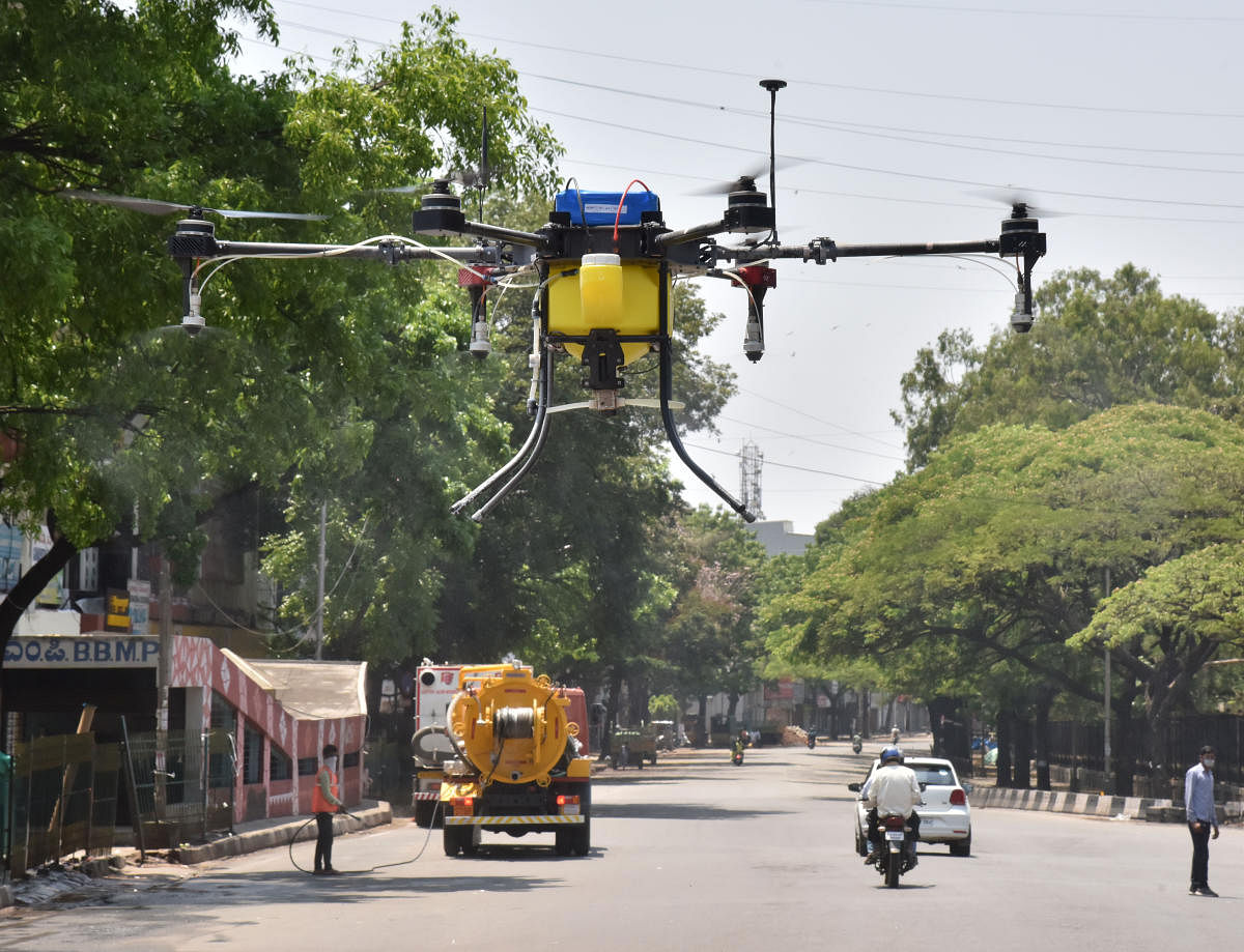 BBMP sprays disinfectant using a drone on the road near Town Hall following the COVID-19 outbreak in Bengaluru on Tuesday, March 24, 2020. Photo by (Janardhan B K/DH Photo)