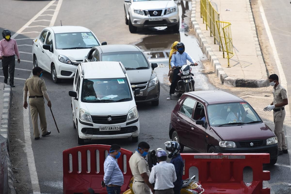 Vehicles are stopped at the state border to cross to Delhi after Haryana government sealed its border with the national capital Delhi during a government-imposed nationwide lockdown as a preventive measure against the COVID-19 coronavirus, in Faridabad on April 28, 2020. Credit: AFP Photo