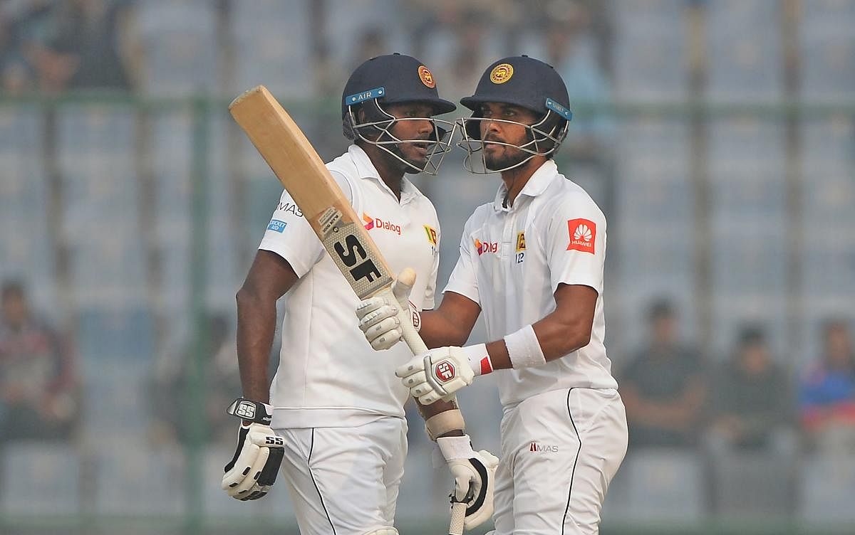 Sri Lanka captain Dinesh Chandimal (right) and his predecessor Angelo Mathews will hold crucial to Sri Lanka's fortunes in the series against West Indies. AFP