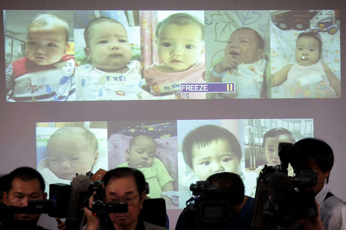 Surrogate babies that Thai police suspect were fathered by a Japanese businessman who fled Thailand are shown on a screen during a news conference at the headquarters of the Royal Thai Police in Bangkok. (Reuters file pic)