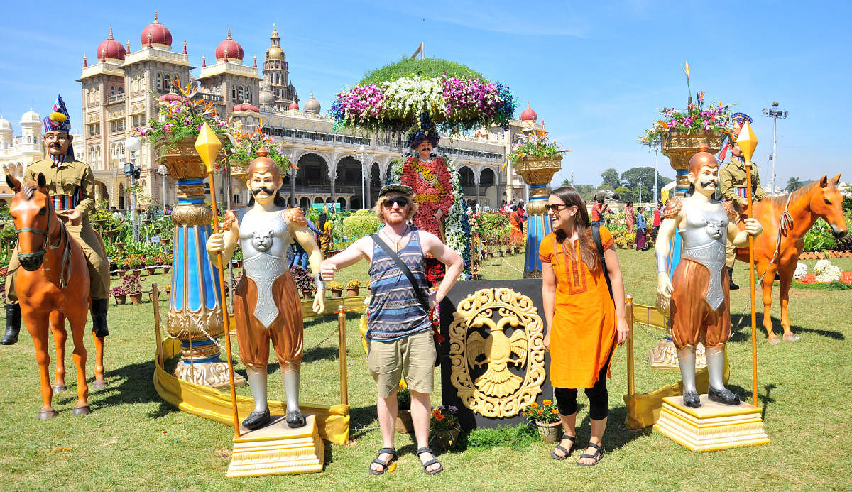 Foreigners visit during the inauguration of Flower Show at Amba Vilas Palace in Mysuru last year. DH-file photo