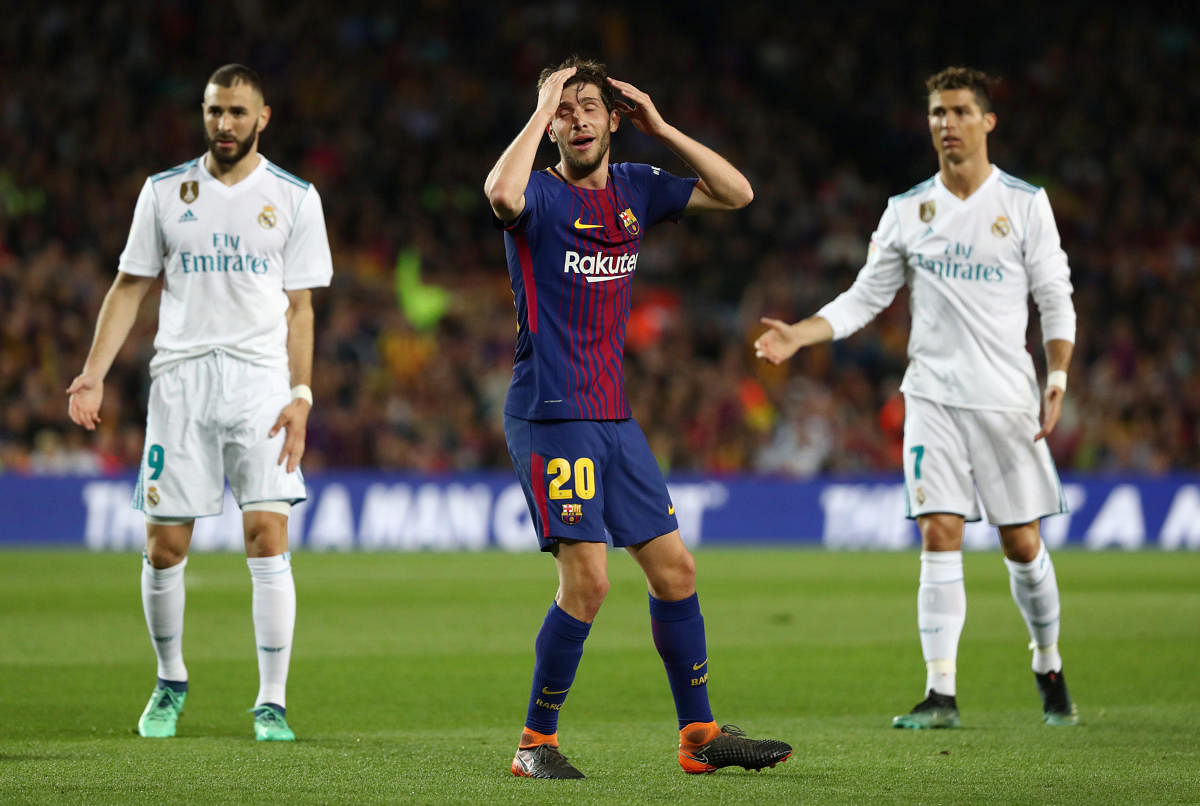 Barcelona's Sergi Roberto reacts after shown a red card. REUTERS