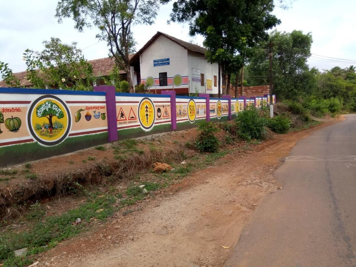 A view of the painting on the compound wall of Government High School at Nadugodu.
