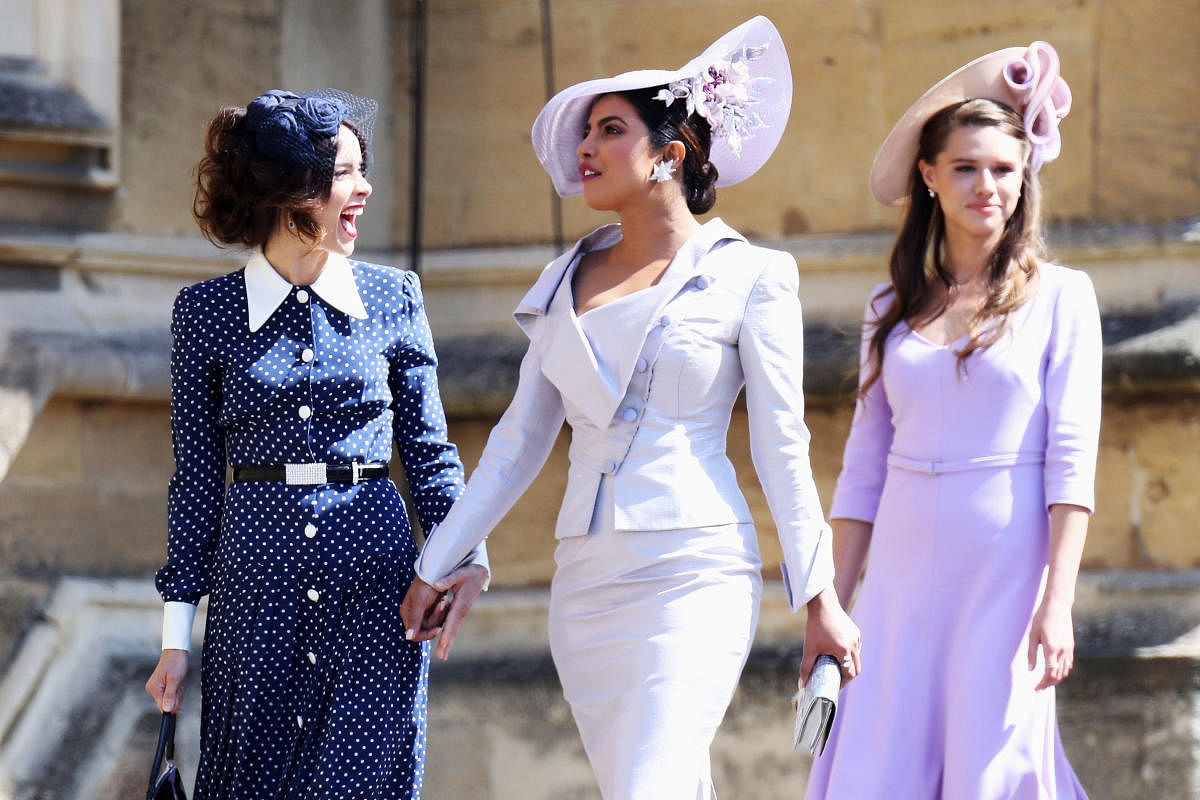(L-R)Abigail Spencer and Priyanka Chopra arrive at the wedding of Prince Harry to Ms Meghan Markle at St George's Chapel, Windsor Castle on May 19, 2018 in Windsor. REUTERS Photo