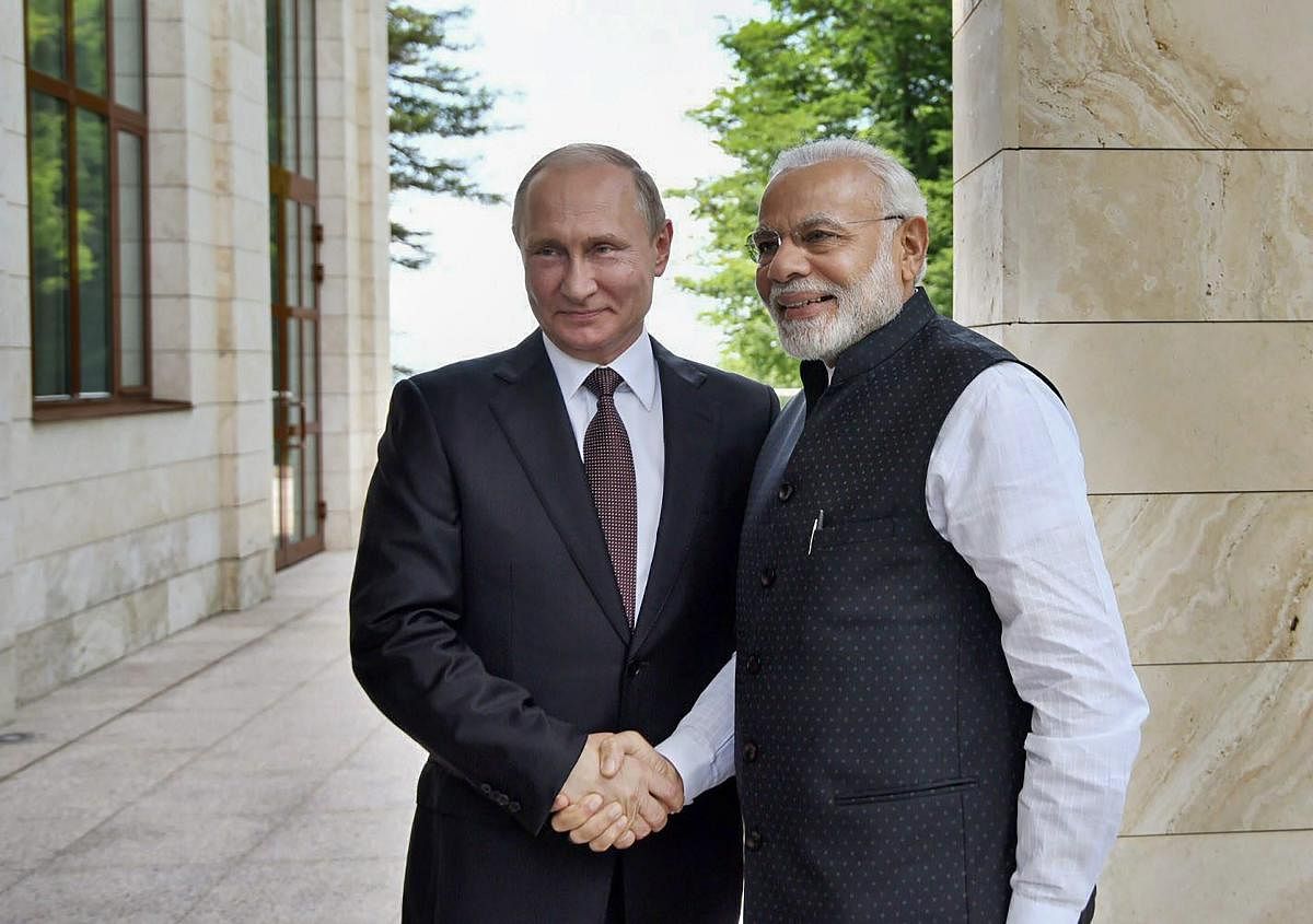 Prime Minister Narendra Modi greets Russian President Vladimir Putin in Sochi. (PTI file pic)